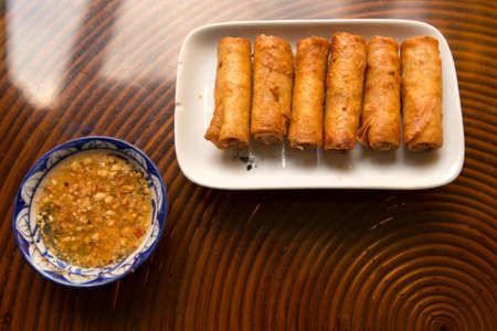 Fried spring rolls with a peanut sauce