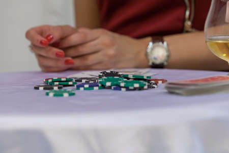 casino chips on white table close up