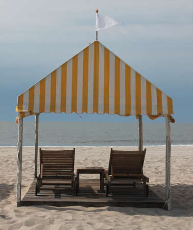 Beach deckchairs and cabanaの写真素材