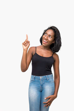 Woman surprised and pointing upの写真素材