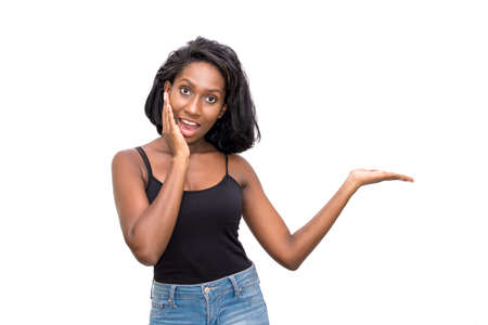 Shocked woman showing productの写真素材