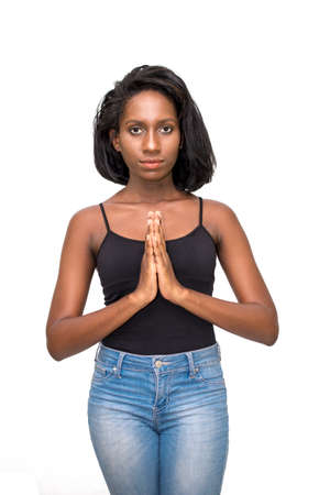 Woman with palms together at chestの写真素材