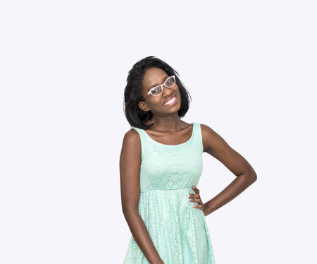 Woman with hand on hip wearing glassesの写真素材