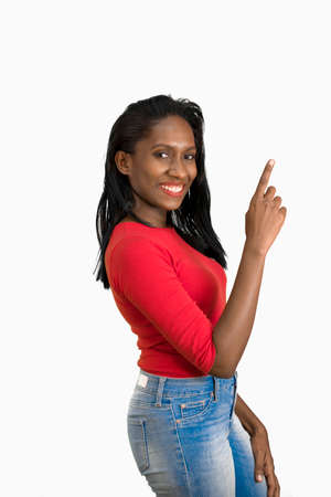 Woman pointing up side viewの写真素材