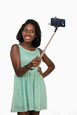 Woman using selfie stickの写真素材