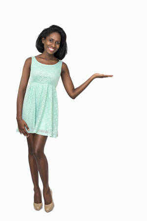 Woman showing product on rightの写真素材