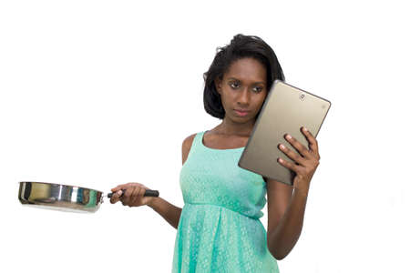 Woman holding pan and digital tabletの写真素材