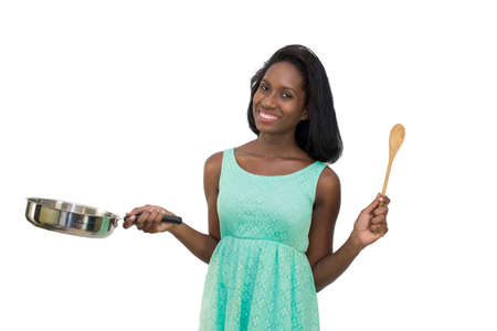Woman holding pan and spoonの写真素材