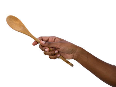 Hand holding wooden spoonの写真素材