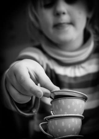 Child Playing with Tea Setの写真素材
