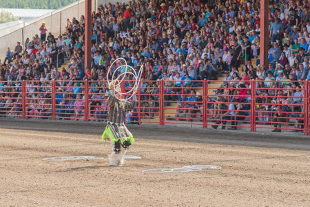 Williams Lake, British Columbia/Canada - July 2, 2016: three time world champion Alex Wells performs a traditional hoop dance at the 90th Williams Lake Stampede.のeditorial素材