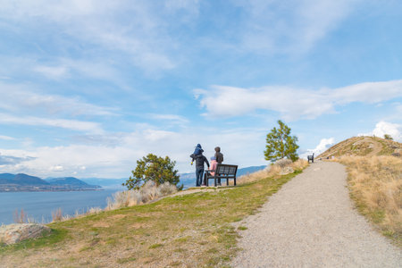 Penticton, British Columbia/Canada - March 21, 2016: a young family enjoys the view of the Okanagan Valley from Munson Mountain, an extinct volcano that is a popular viewpoint for tourists and locals.のeditorial素材