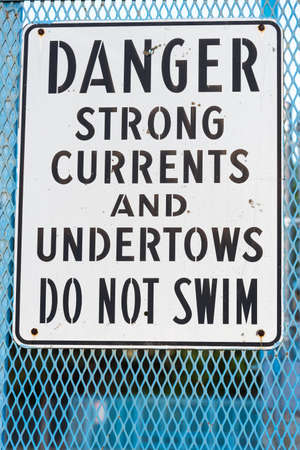 Danger do not swim sign warning of strong currents and undertowsの写真素材
