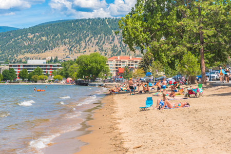 Penticton, British Columbia/Canada - July 7, 2018:  tourists and locals relax and enjoy Okanagan beach in downtown Penticton on a hot summer afternoonのeditorial素材