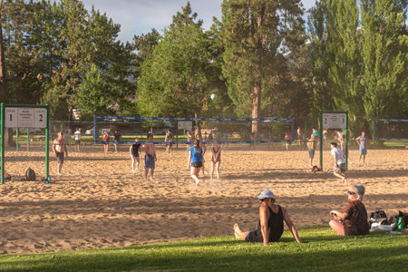 Penticton, British Columbia/Canada - June 13, 2019: various teams enjoy playing beach volleyball at Skaha Lake Park, a popular destination for tourists and localsのeditorial素材