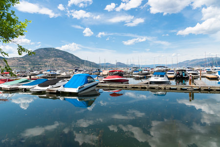 Penticton, British Columbia/Canada - June 13, 2019: view of boats and docks in summer at the Penticton Yacht Club and Marina, the largest marina on the south end of Okanagan Lake.のeditorial素材