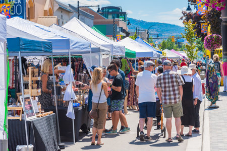 Penticton, British Columbia/Canada - June 15, 2019: shoppers and sellers fill Main Street for the Penticton Community Market, a popular weekly event.のeditorial素材