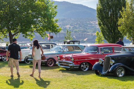 Penticton, British Columbia/Canada - June 22, 2019: people viewing vintage cars on display at the Peach City Beach Cruise, a popular annual car show.のeditorial素材