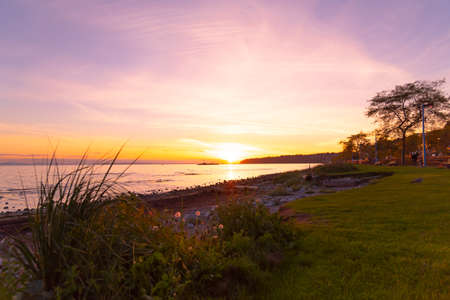 Beautiful sunset with view of the Pacific Ocean in White Rock, British Columbia, Canadaの写真素材