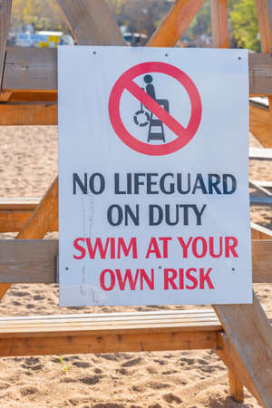 No lifeguard on duty sign on beachの写真素材