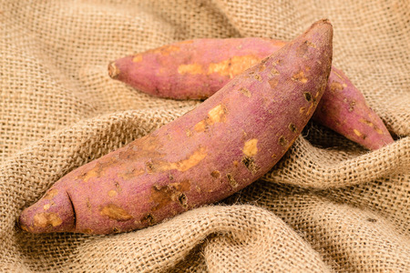 red sweet potatoes on the burlap.の写真素材