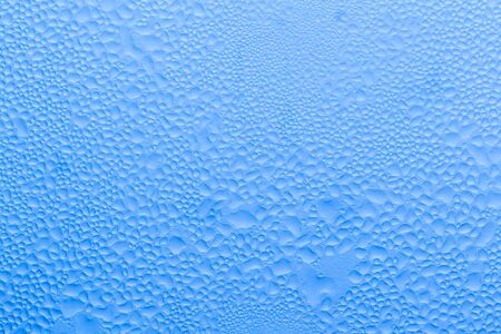 blue background of water drops.の写真素材