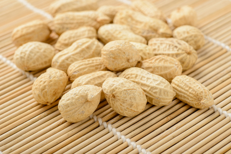 peanuts on the bamboo matの写真素材
