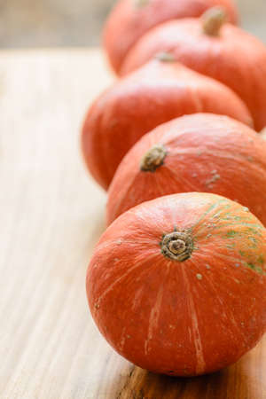 orange pumpkins on the wooden boardの写真素材