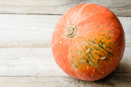 orange pumpkins on the wooden boardの写真素材