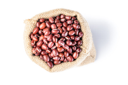 red beans in the sack on the white backgroundの写真素材