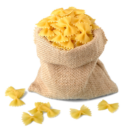 uncooked farfalle pasta in sackの写真素材