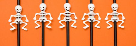 Halloween straws on the orange backgroundの写真素材
