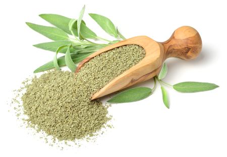 rubbed sage in the wooden scoop, isolated on whiteの写真素材