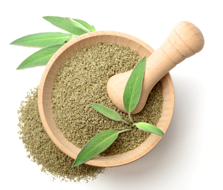 dried salvia in the wooden mortar, isolated on white, top viewの写真素材