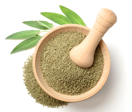 dried salvia in the wooden mortar, isolated on white, top viewの写真素材