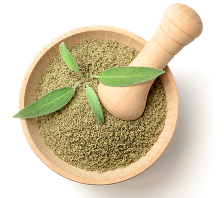 dried salvia in the wooden mortar, isolated on white, top viewの写真素材