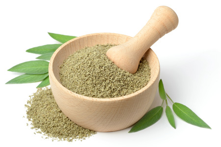 dried salvia in the wooden mortar, isolated on whiteの写真素材