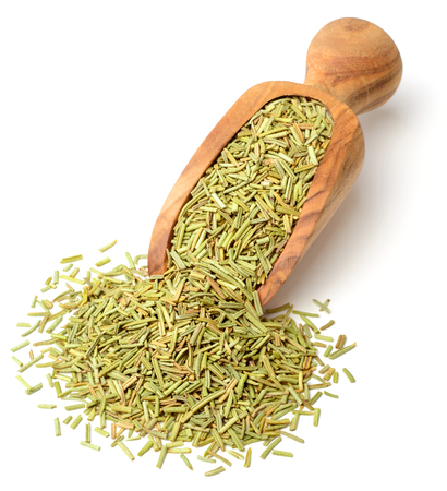 dried rosemary in the wooden scoop, isolated on whiteの写真素材