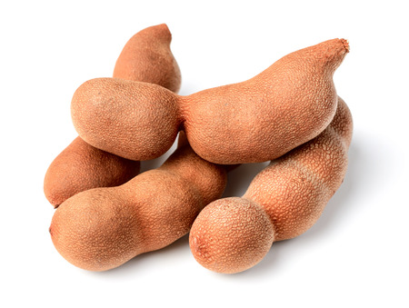 fresh tamarind fruit isolated on whiteの写真素材