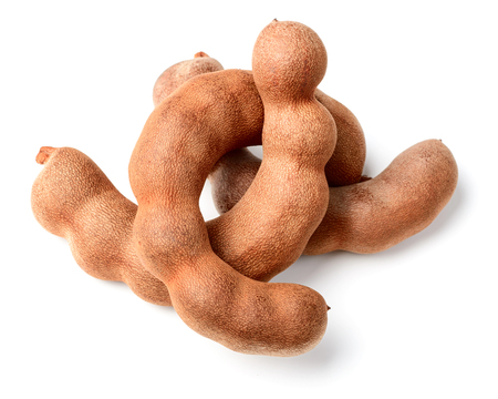 fresh tamarind fruit isolated on whiteの写真素材