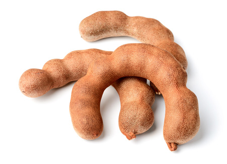 fresh tamarind fruit isolated on whiteの写真素材