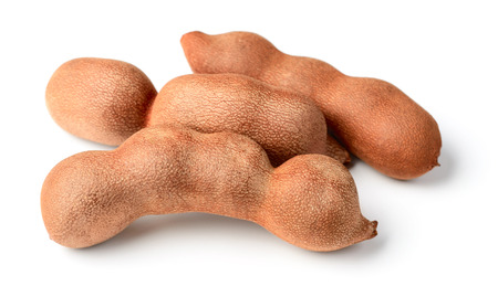 fresh tamarind fruit isolated on whiteの写真素材