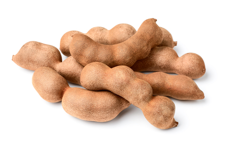 fresh tamarind fruit isolated on whiteの写真素材