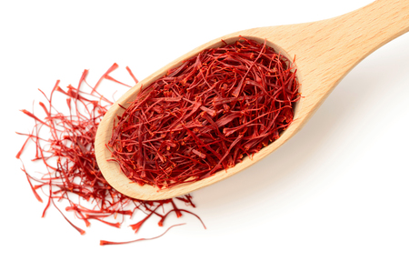 saffron thread in the wooden spoon, isolated on white background, top viewの写真素材