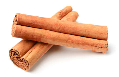 closeup of Ceylon cinnamon sticks isolated on whiteの写真素材