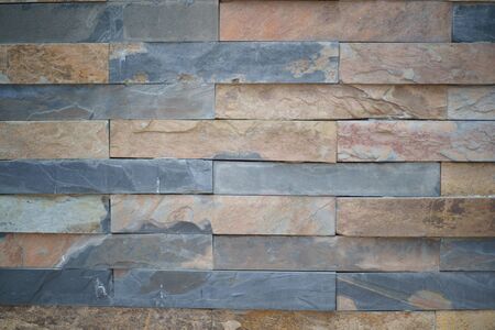 texture Background of Natural granite stone wall made with blocks close upの写真素材