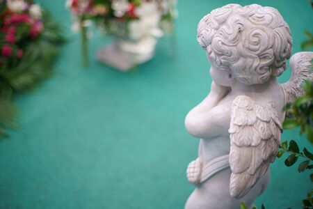 Cute Angel statue in the garden. Beautiful, thais, cupidの写真素材