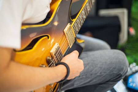 Hands and Electric guitars of young guitarists playing guitar conceptsの写真素材