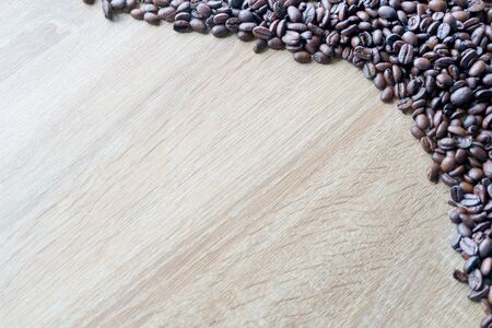 Coffee beans On a wooden table background. Simplicity Conceptの写真素材