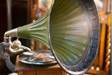 Retro old gramophone radio. Vintage aged turquoise gramophone phonograph turntableの写真素材